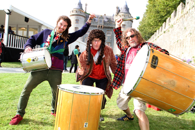 Joe McCardle and Paul Taylor of the Streetwise Circus Samba Band with Sir Hans Sloane aka Clive Scoular let loose of the drums at last year's Chocolate Ball celebrations. 