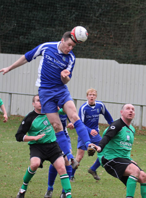 Peter Telford using his head for Kilmore Rec scores a crucial goal.