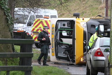 The Knockeven school bus lies on its side after the crash on the Vianstown Road.