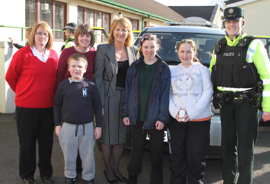 Pupils of Knockevin School in Downpatrick pictured with classrom assistant Alison Synott, teacher Christie Clarke, school principal Ann Cooper and Constable Caroline Owens, Downpatrick Neighbourhood team.