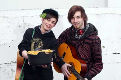SERC Art and Design students Ryan Meehan and Peter Jones from Castlewellan tune up for the street music session in Downpatrick during the St Patrick Festival. (Photo by Darren Kidd/Presseye).