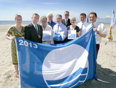 Down Blue Flag (L-R): Lynsey McCloskey, Campaign Manager, TIDY Northern Ireland; Cllr Michael Coogan; Simon Boyle, Warden, Down District Council; David Thompson, Coast and Countryside Manager, Murlough Beach, The National Trust; Environment Minister Alex Attwood; Michael Lipsett, Director of Recreation, Down District Council; Margaret Ritchie, MP for South Down; Conal Stewart, Northern Ireland Tourist Board & Ian Humphreys, Chief Executive, TIDY Northern Ireland