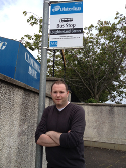 South Down MLA Chris Hazzard delighted at a bus shelter being installed in Loughinisland. 