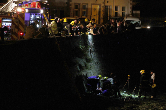 The scene at the Seaview beach in Ardglass as an injured man is attended to my ambulance staff after sustaining injuries going over the harbour wall.