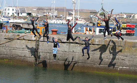 Some teenagers enjoy a dip in Ardglass harbour during a sunny spell at the weekend at the start of their summer holidays.