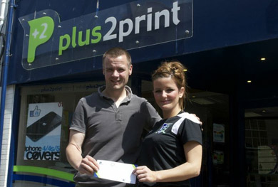Gavin Oakes of Plus2Print  receives his voucher from Kerry Fisher, Downpatrick FC Committee member. 