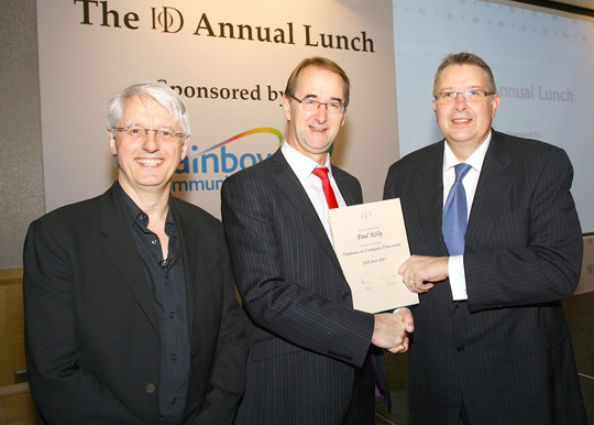 Downpatrick man Paul Kelly receives his IoD award.