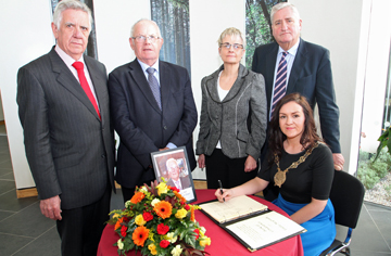 Chairperson of Down District Council, Cllr Marie McCarthy, signs the book of condolence for EK McGrady, former local councillor and MP for South Down. Pictured are John Dumigan, Down Distict Council Chief Executive, Cllr Patsy Toman, South Down MP Margaret Ritchie, and Cllr Eamonn O'Neill.