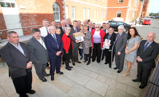 Local health campaigners and politicians hand over the 20,000 signature petition to Health MInister Edwin Poots.