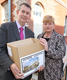 Health Minister Edwin Poots receives over 20,000 signatures from Anne Trainor who co-ordinated a group for the Down Community Health Committee that gathered the signatures across Down District.