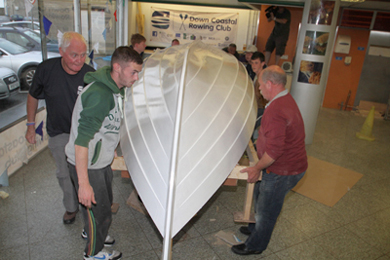 The Ardglass branch of  Down Coastal Rowing turn over their St Ayle's skiff. 