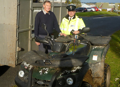 Con Gary McKeown of Brownlow NPT handing over recovered stolen property to owner Ernest Patterson from Killinchy.