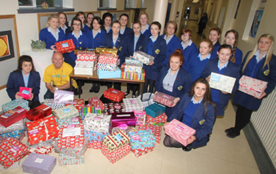 Students from all the forms at St Mary's High School in Downpatrick present John Young of Team Hope with over 100 shoeboxes of aid for children in Eastern Europe.