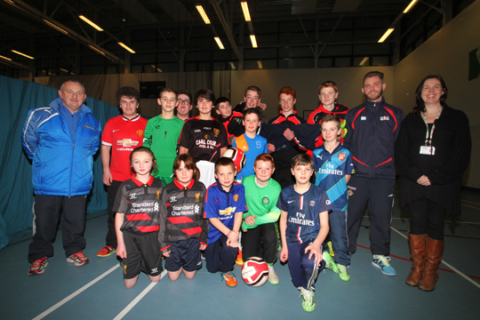 Some of the children at the launch of the multi-sports' programme in the Ballymote Sports and Wellbeing Centre across Down District organised by the Down PCSP. Included are coaches Des Maquire and Graham Crory with Pamela Quiery, Community Support worker with ASCERT. 