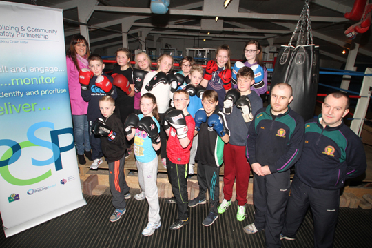 Young boxers at the East Down Boxing Club with their coaches and Down PCSP officer Katrina Hynds.