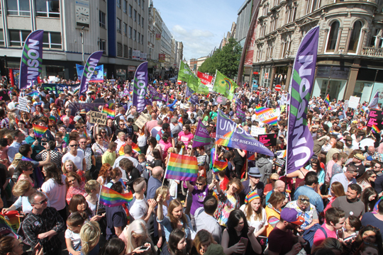 People power: The parade of thousands streamed into the front of the Belfast City Hall to listen to the speakers calling for equal marriage rights for the LGBT community.