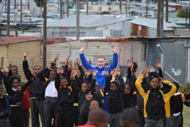 Kieran Laverety surrounded by his soccer fans in South Africa during his visith earlier in 2015 to coach young people in Capetown.