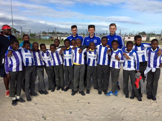 Kieran Laverty, back right, pictured with some of the young players from Capetown.