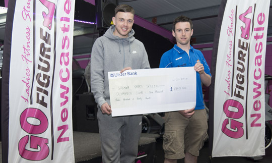 Well done!  Shimna Stars Manager Daniel Hardy, right, receives the donation from Adam Mitten  of Go-Figure in his Newcastle fitness studio premises. 