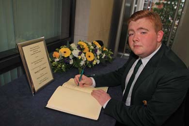 James Savage from Killyleagh about to sign the Book of Condolence.