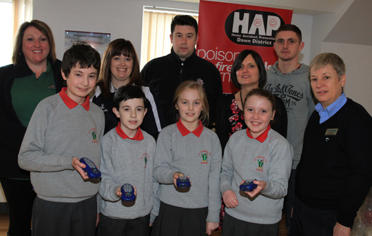 Pupils from St Patrick's Primary School in Saul at the Bee Safe awareness session in the Ballymote Centre in Downpatrick. Included are from left, JUlie Leatham. HSENI; Heather Holland, County Down RCN; Colin Dryden, Anne Murray, HAP Chair; Jack Rice, NIE; and Susan O'Neill, Translink.