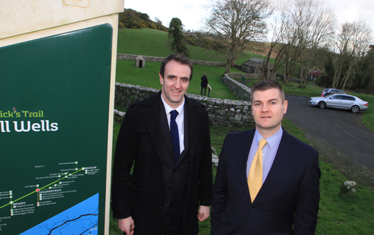Calling for tourism improvements at Struell Wells near Downpatrick is Councillor Colin McGrath, right, giving a tour of the site to Environment Minister Mark H Durkan.