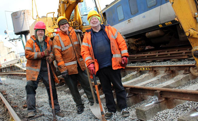 Alf Burns, Dessie Morrison and Colin Holliday in front of the Komatsu digger