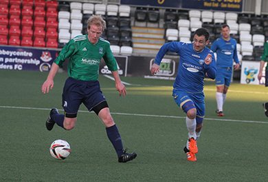 Philly Traynor on the ball heads for the Lisburn Rangers goal area.