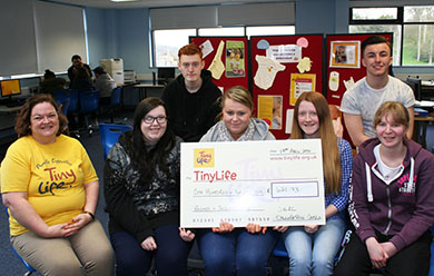 SERC business and adminsstration students who tundraised fro Timy Life with Tiny Life representative