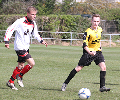 Comber’s Jordan Dougherty on the ball as Killyleagh keep up the pressure in the first half.