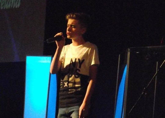 Killyleagh's Curtis Croskery in action on stage with the mike.