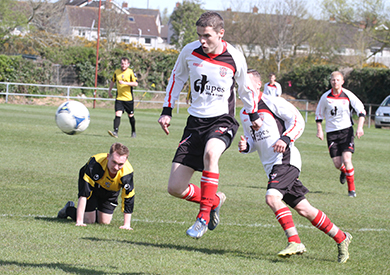 Gary Murray makes a powerful challenge for Killyleagh.