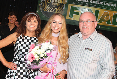 Anna McCartan and RGU chairman Collie Quinn present choreographer Jenna Finnegan with a bouquet.