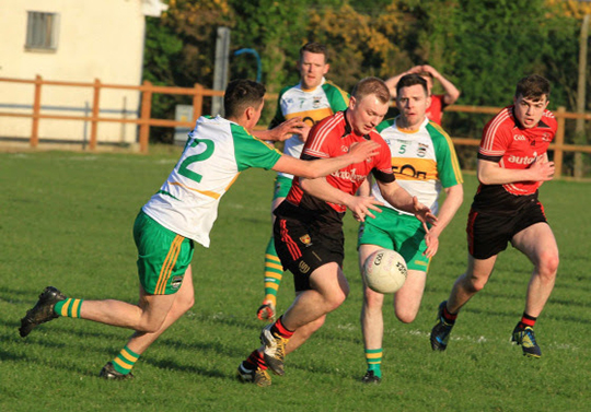 Action in the match between An Riocht and Rostrevor.