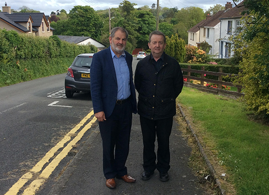 Councillor Garth Craig, left, pictured with Hugh Morgan of Roads Service look over the road issues near Spa. 