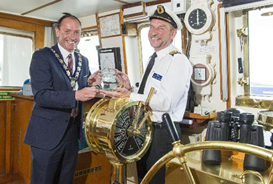 Newry Mourne and Down District Council Chairperson, Cllr Mickey Ruane Newry, Mourne and Down District Council Chairperson, Councillor Mickey Ruane presented a plaque to Captain Trevor Bailey, Master of the Hebridean Princess.