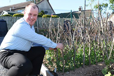 Antony McMullan who attends Mountview Centre at his allotment in Downpatrick.