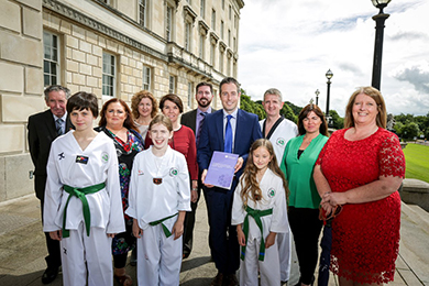 MInister Paul Givan launches the Small Grants Scheme with the help of local volunteers.