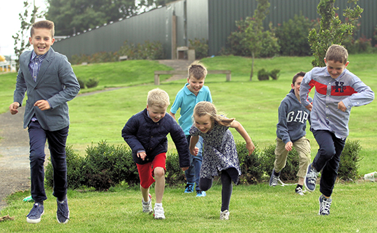 Jake Hamilton (left), son of local trainer Brian Hamilton, leads from his younger brother Sam (right) as the youngsters organise their own hurdle race.
