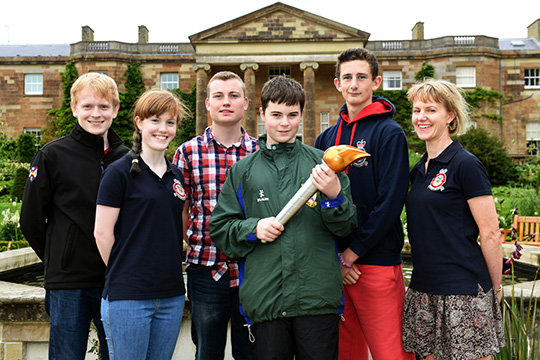 A hand on history: against the iconic backdrop of Hillsborough Castle, Air Cadets representing Ballynahinch Squadron celebrate the 75th anniversary of the Air Cadets movement. Pictured, from left, are Civilian Instructors Christopher Robinson and Sarah Ruddell, Cadet Corporal Dylan Watson; Cadet Thomas Evans; Cadet William Orr and Flying Officer Joy Ruddell.