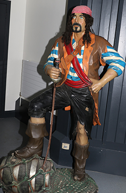 A pirate stands on guard at the entrance to Exploris.