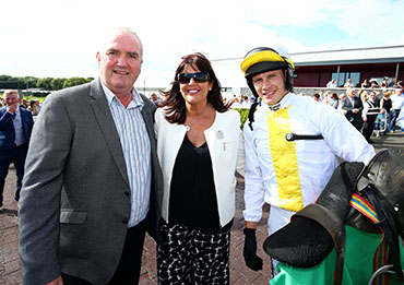 Mountain Kingdom owners Cathal and Barbara McGovern with jockey Paul Townend after winning the Giltspur Scientific Best Dressed Man Maiden Hurdle during Ladies Day at Downpatrick Racecourse.