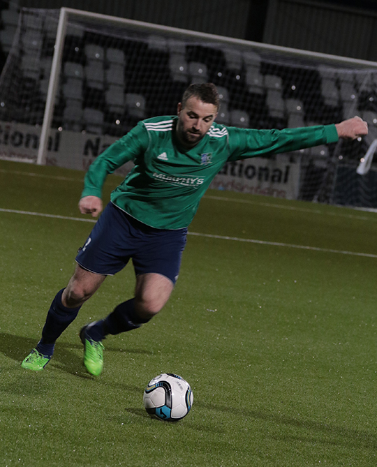 Solid in defence … Neil Teggart playing for Downpatrick.