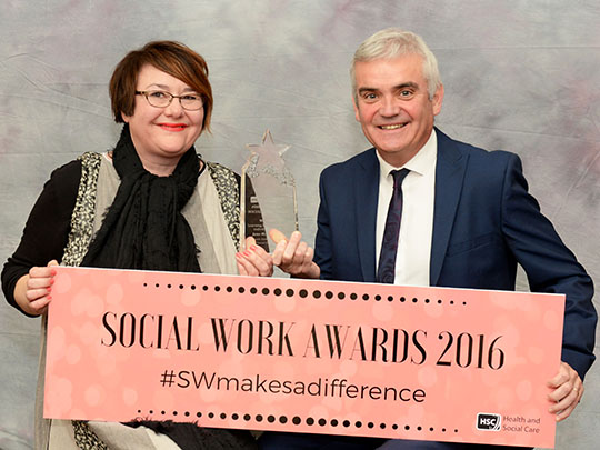 Jayne is pictured receiving her award from Colum Conway, Chair of the Learning & Development Award Panel