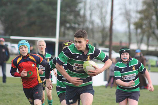 Niall McAllister bursting to the line supported by Anthony Donnelly.