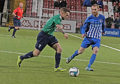 Downpatrick's Barry Treacy pressing forward in midfield against Immaculata.