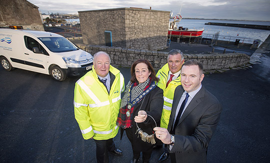 (L-R) Dermott McCurdy NI Water, Councillor Gillian Fitzpatrick Chairperson of Newry, Mourne & Down Council, Keith Henderson NI Water and Minister Chris Hazzard pictured at Newcastle harbour during a tour of the £8m upgrade at Newcastle Wastewater Treatment Works. NI Water handed over the keys of the generator house to the council, which was no longer required at the Newcastle plant following the refurbishment. The generator house will be used as a Harbourmaster’s Office and Public Information Point, which will enhance the Harbour as part of the Council’s Regeneration Plan. Picture by Brian Morrison
