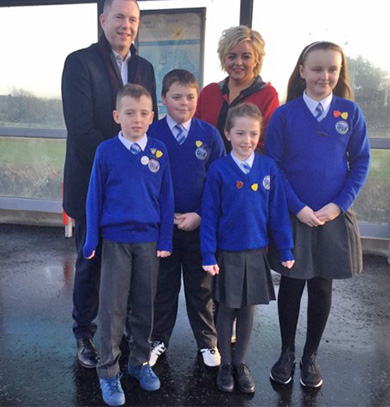 Infrastructure Minister Chris Hazzard with Christ the King PS Principal Mrs and pupils from the school.